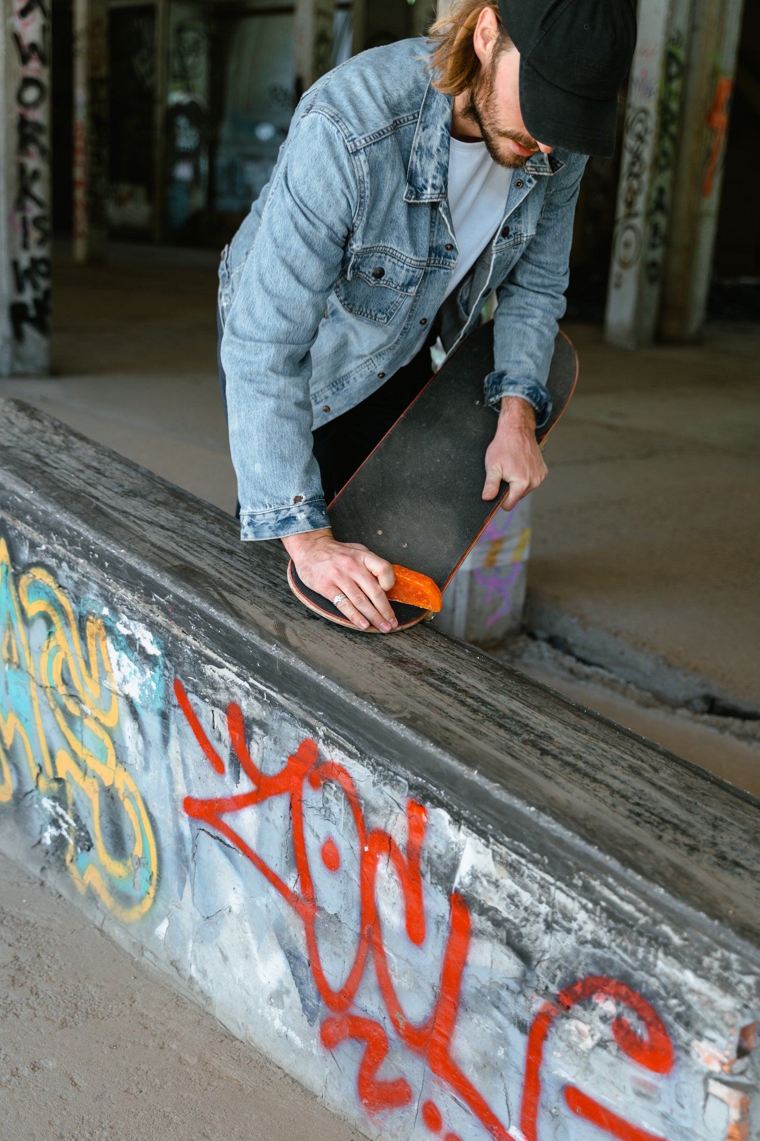 Skateboarder Waxing a Ledge for Grinds